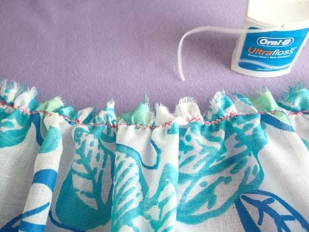 At last!  A quick and easy way to gather long pieces of fabric with out breaking the gathering threads, ever.  The secret is in the dental floss!
