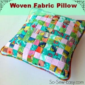 Woven fabric pillow made from weaving strips of folded fabric. Great scrap buster and so pretty too!