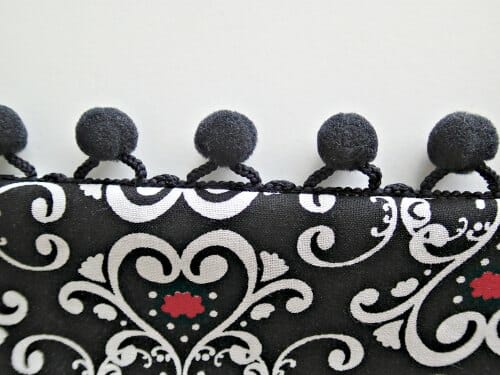 Make luxury bedroom pillows with pom pom trim and snap tape backs. Love the idea of using a velvet too.
