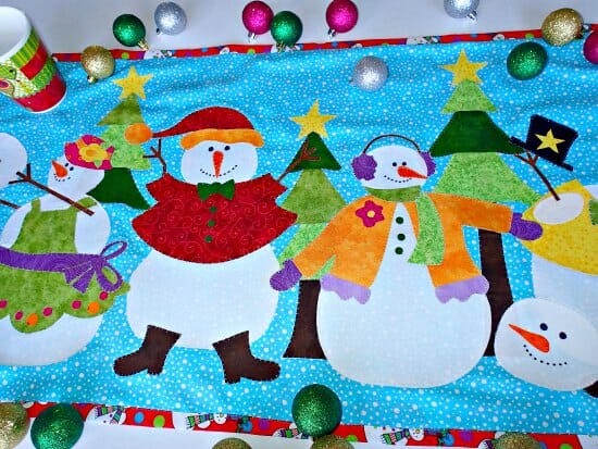Love the bright colors in this snowman table runner. Would also make a great mini quilt or wall hanging.