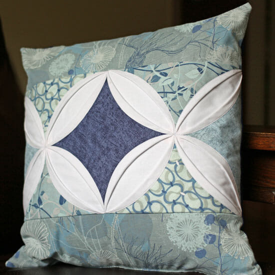 Cathedral window pillow cover.  Oh wow, this is simply fabulous.  I love how the two designs come together to make a central window too.
