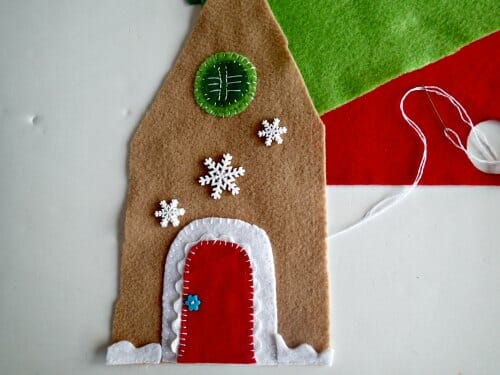 Felt Gingerbread house.  This is a tissue box cover, but you could easily stuff it, or use an empty tissue box as  the frame.  I'll be making a mini village!