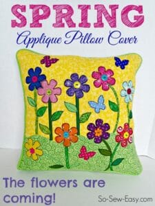 Love the bright colors in this Spring Applique Pillow Cover idea. The raised flowers and buttons add a nice touch.
