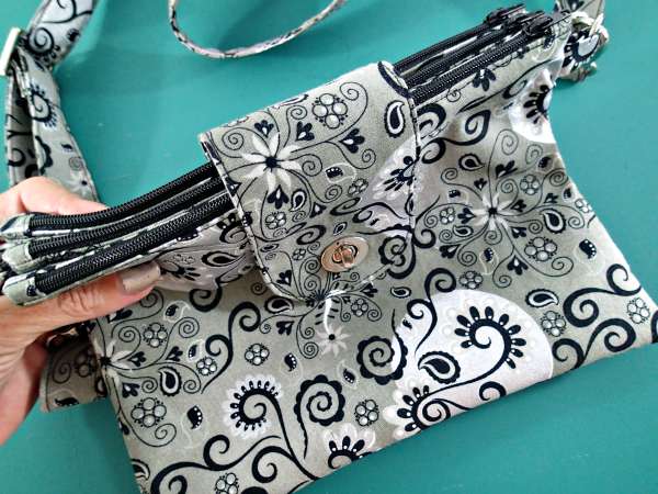 The Trinity Bag is a triple zipper pouch all joined together and closed with a flap and with a removable strap. I've never seen a pattern for a bag like this before - I need one! 