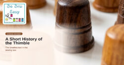 Wooden thimbles on a white surface — So Sew Easy sewing history